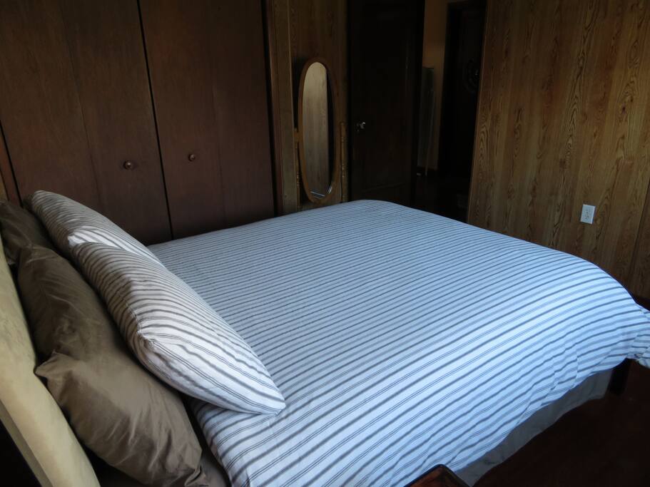 Bed has a comfortable mattress pad and pillow covers. All linens are washed with hypoallergenic lavender detergent.