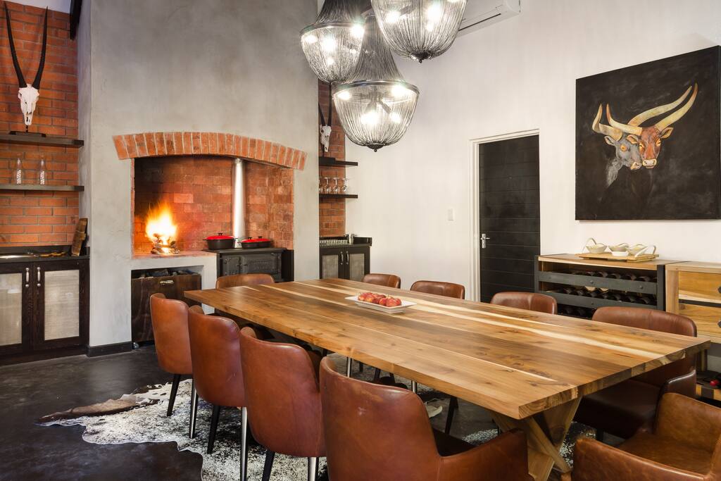 Dining room in main area with indoor barbecue and coal stove