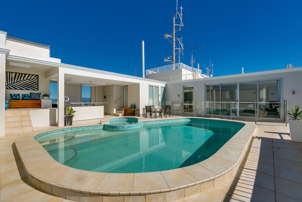 ROOF TOP POOL LOOKING BACK TO BEDROOM AND BBQ AREA