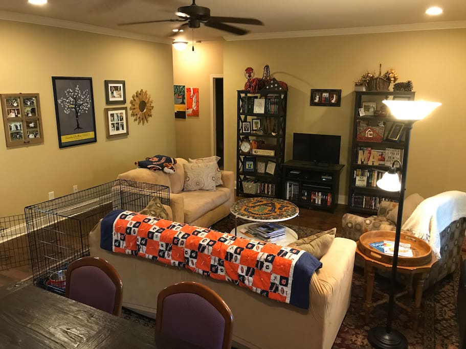 The living room: ample seating in an open concept. A sofa, love seat, and chair make for easy relaxation. If you are bringing a dog, no need to haul a crate - this room has an extra large one! It collapses as well, so if you'd rather have more space we can take it down.
