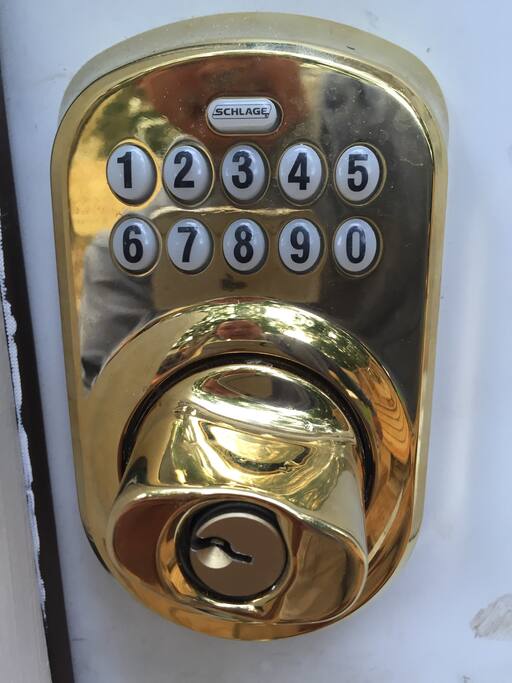 Need to go thru two of the same electronic door locks. Common door then 7 steps down to your main door on your left. Hit schlage button and turn knob left to lock both doors.