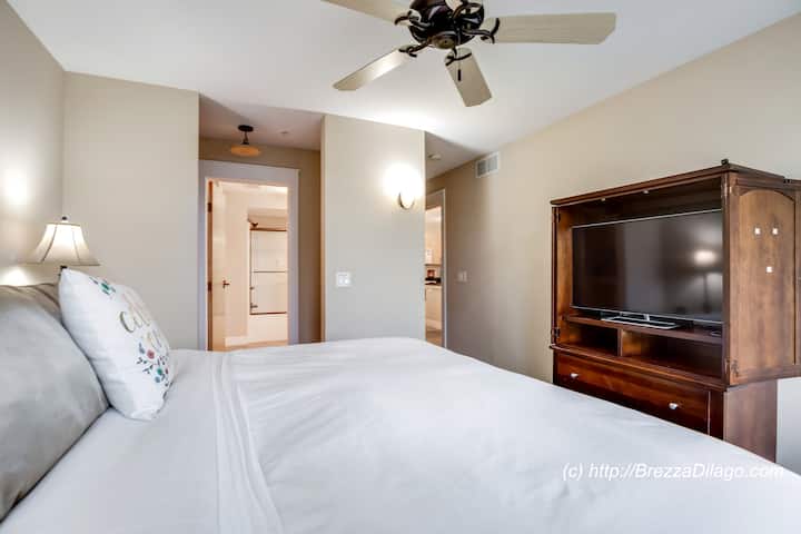 King Sized Master Bed w/Premium bedding, Remote control electronic Adjustable Back and Legs, Fire TV incl Netflix, Amazon Prime Video, Pandora.  Private slider to deck.  Shared entrance to bathroom.  USB and Power adapters for electronic devices.