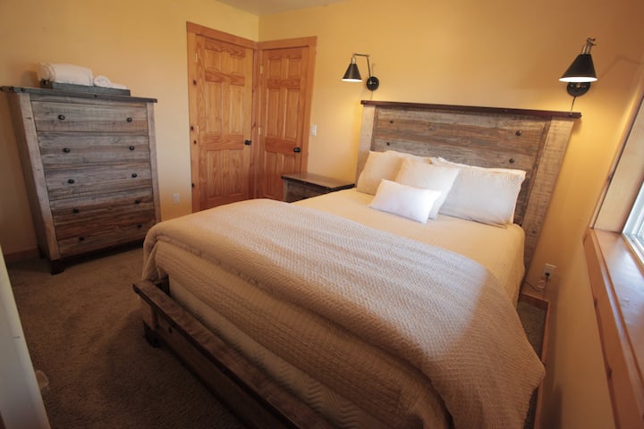 Private downstairs suite with a full bath and lake view.