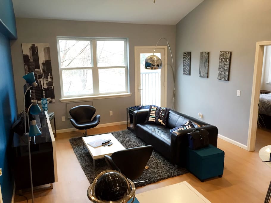 Living area view with master bedroom to the right .
