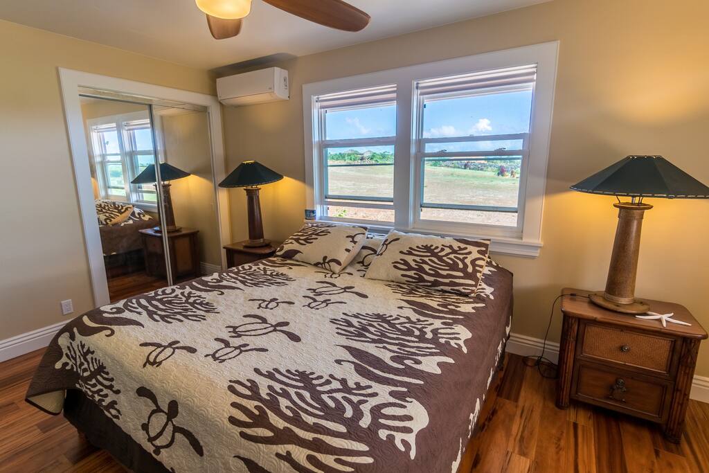Comfy king size bed in large room with beautiful private views