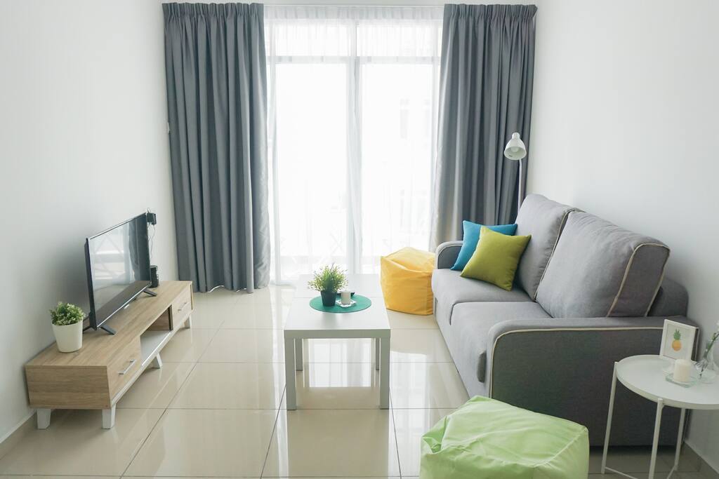 Living Room with Couch, Bean Bags, Coffee Table, Side Table and TV set