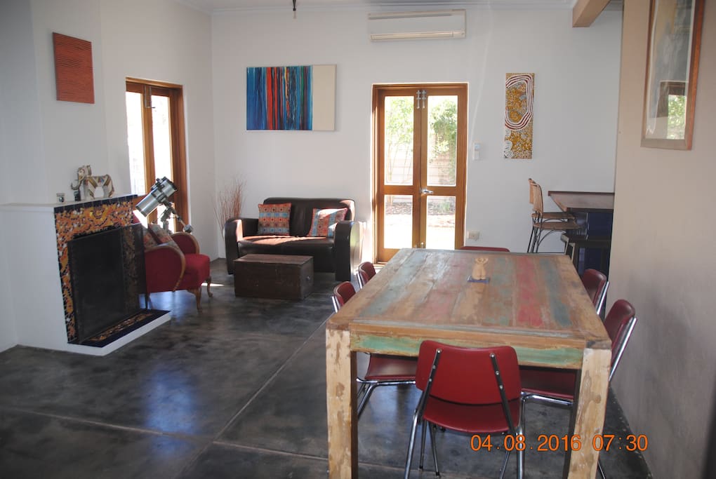 dining room/ lounge room one which overlooks pool and backyard.