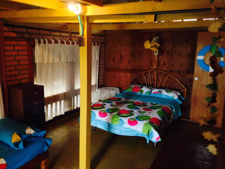 The master bedroom has direct access to the balcony and an extra single bed.