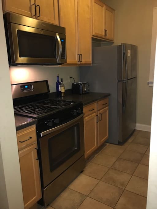 Kitchen. Fridge, Stove,Microwave, & Toaster.