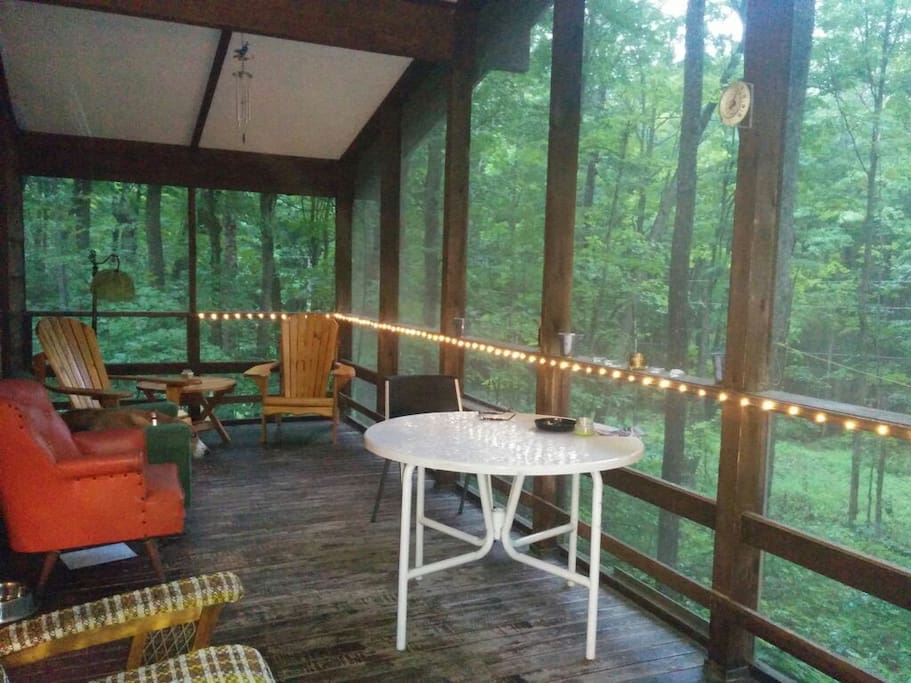Private screened in porch with seating , table for cards etc