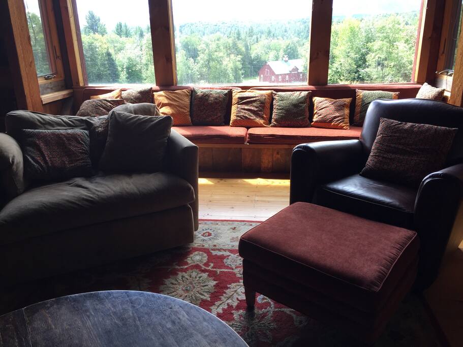 The living room is big enough for everyone to get cozy around a roaring fire.