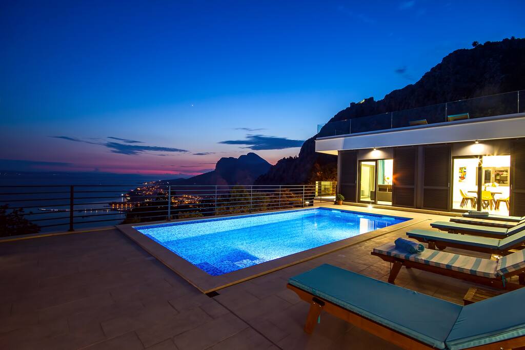 Beautiful sunset view on town Omiš and sea