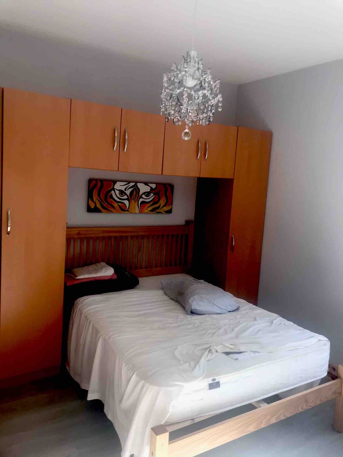 The double bed and chapel wardrobe.