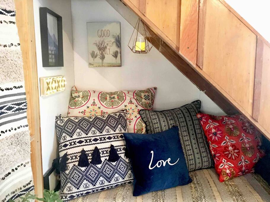 Cozy living room daybed for seating and sleeping one. Special lighting for warm ambiance throughout cabin.