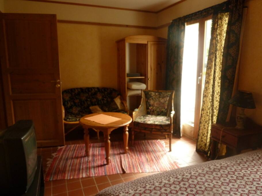 Double room with access to garden deck.