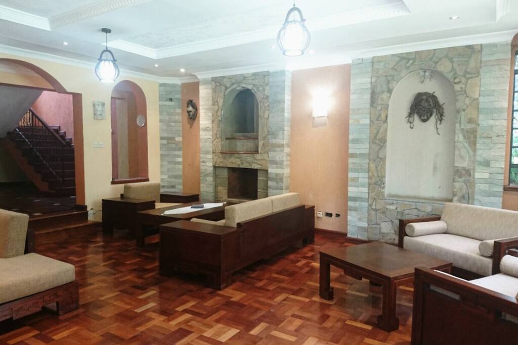 Lounge with ethnic masks and comfortable stylish couches.
