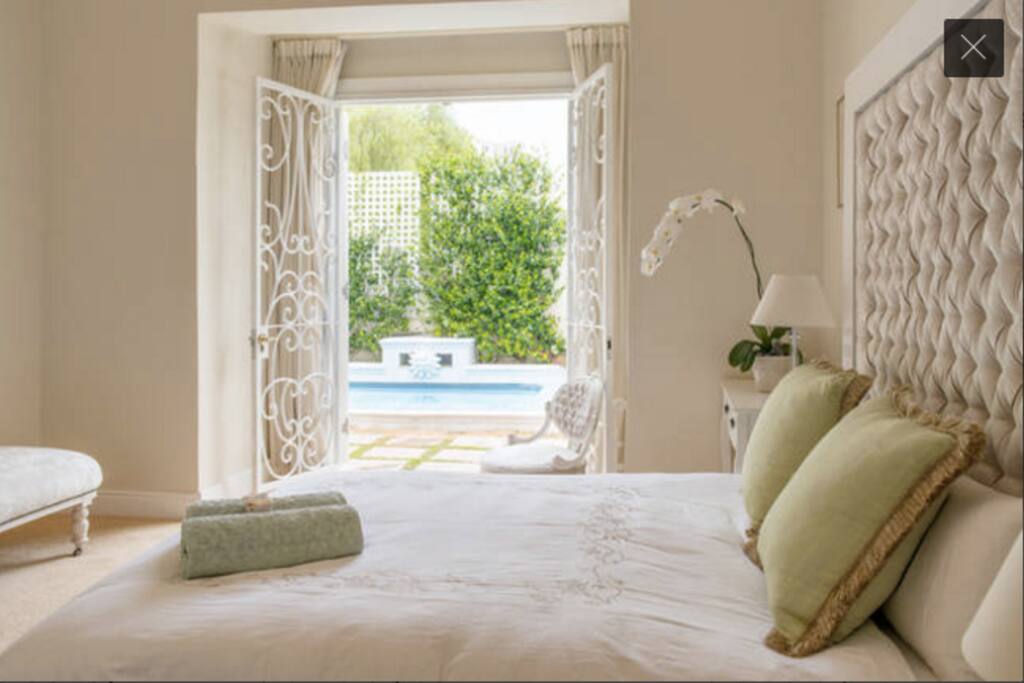 Beautiful giant ensuite room with flatscreen TV, private secure access to pool and garden
