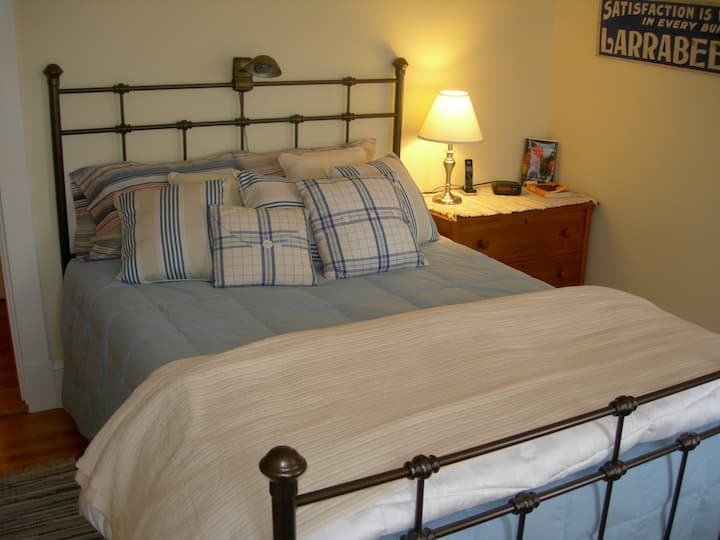 Rear bedroom with queen bed and a view of the back bay.