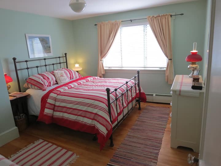 Front bedroom with a queen bed and view of Damariscotta Harbor.