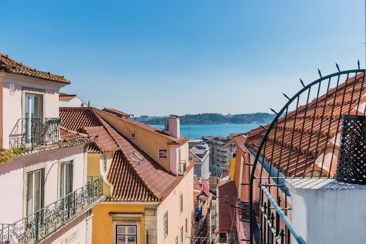Your colorful nest with balcony over the river.