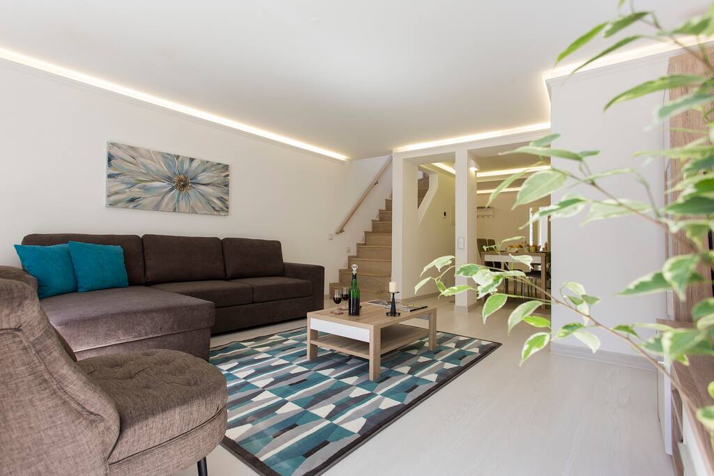 Living room + stairway to bedrooms