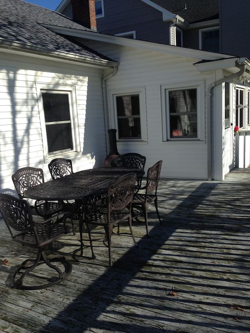 Spacious deck with tasteful and comfortable furniture.