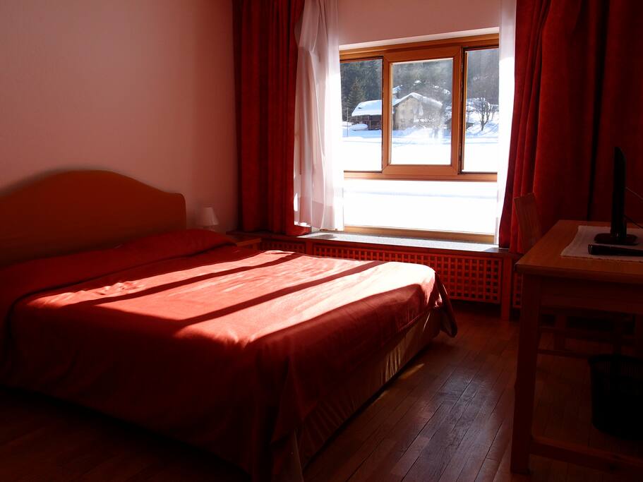 Double bed room, view on meadow and mountains