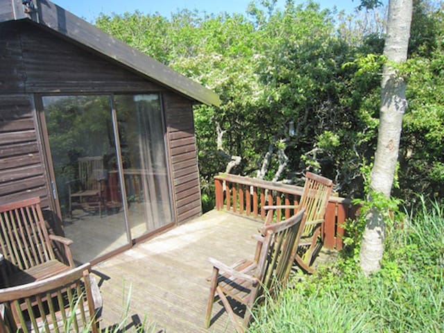 Tree House in sheltered valley with path to cove.