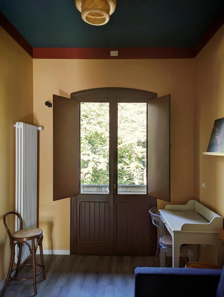 Living room with sofa bed and study corner