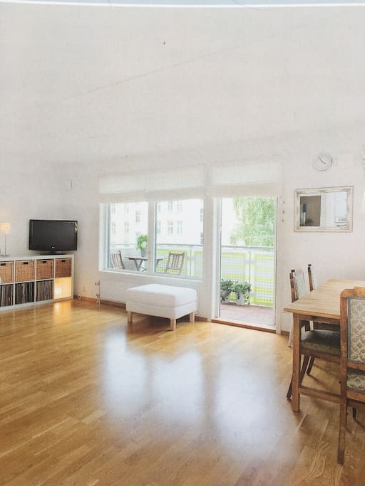 The living room, big and light. Couch, big dinner table for up to 10 persons. Different furniture from the pictures.