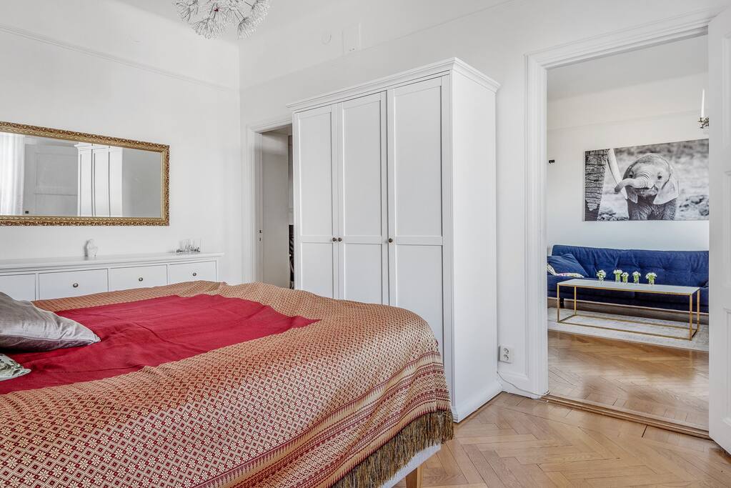 The bedroom has good storage space with both wardrobe and chest of drawers.