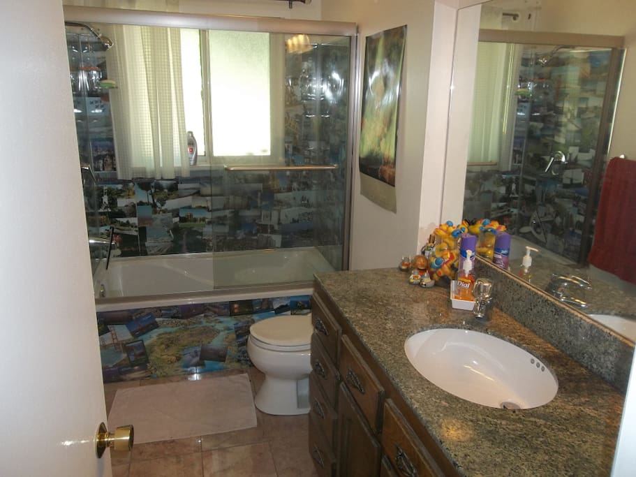 Bathroom with shower over tub