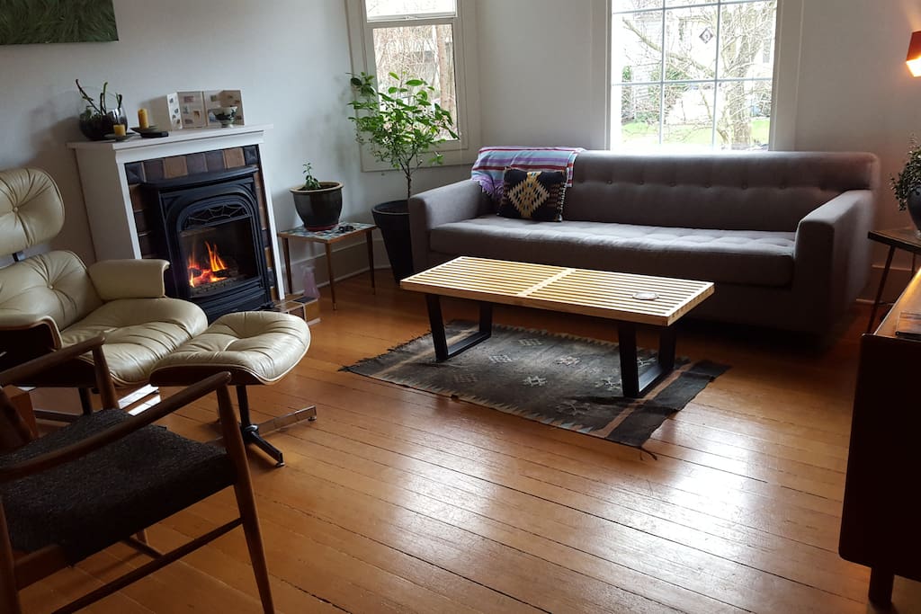 Sunny living room. Fireplace keeps the space cozy in the wintertime.