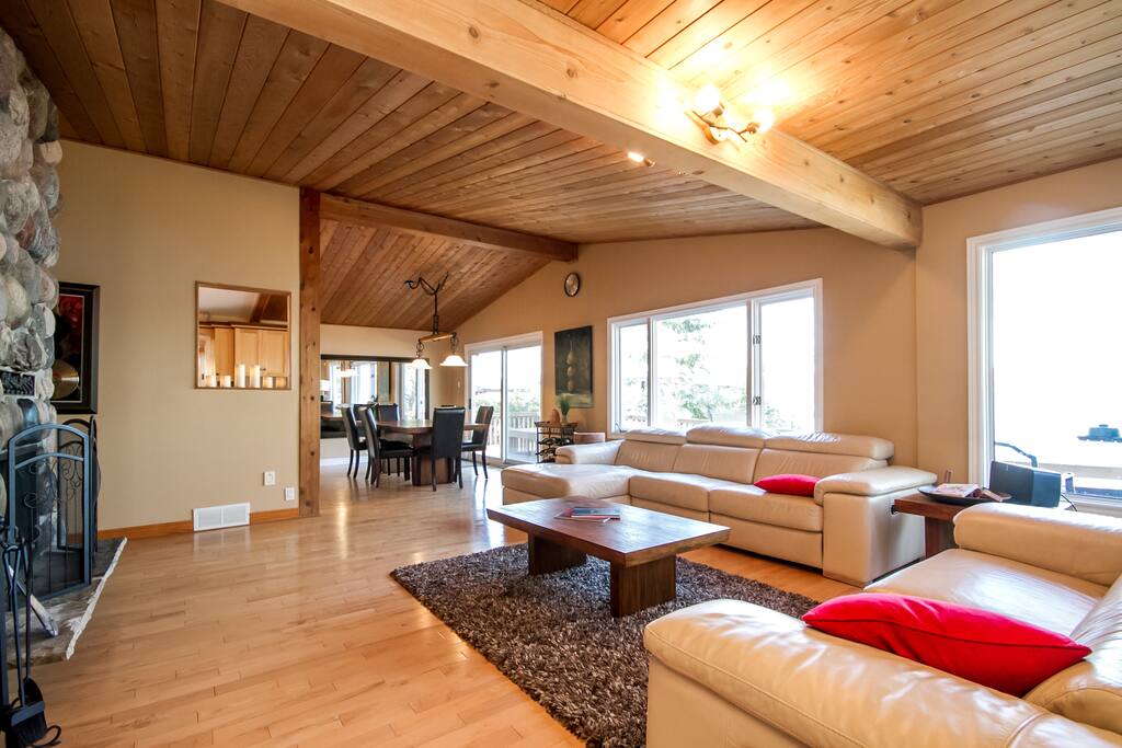 Large Family room with 1960 stone wood fireplace with a gorgeous view