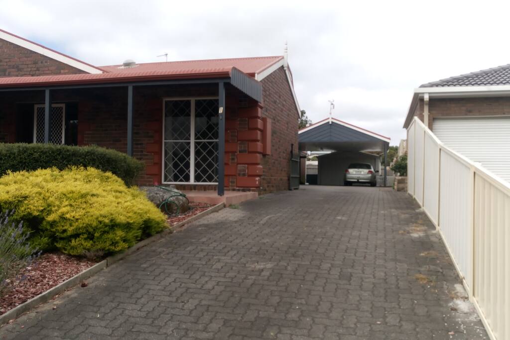 Entrance driveway to undercover parking and private cottage entrance
