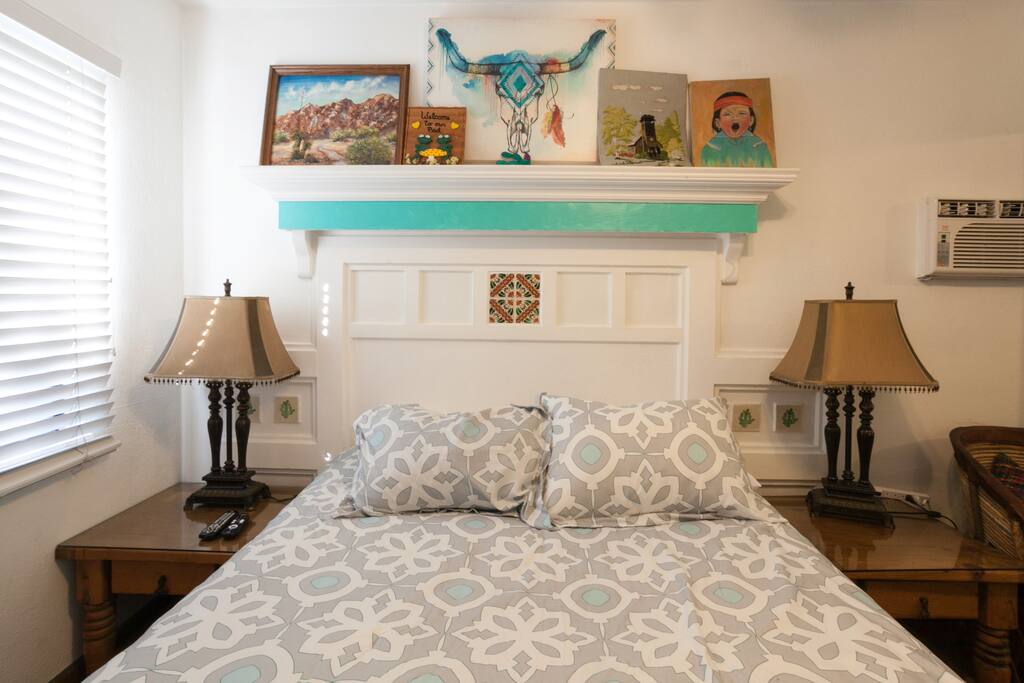 This is the bedroom. A queen size bed, with duel night tables, lights and charging stations.