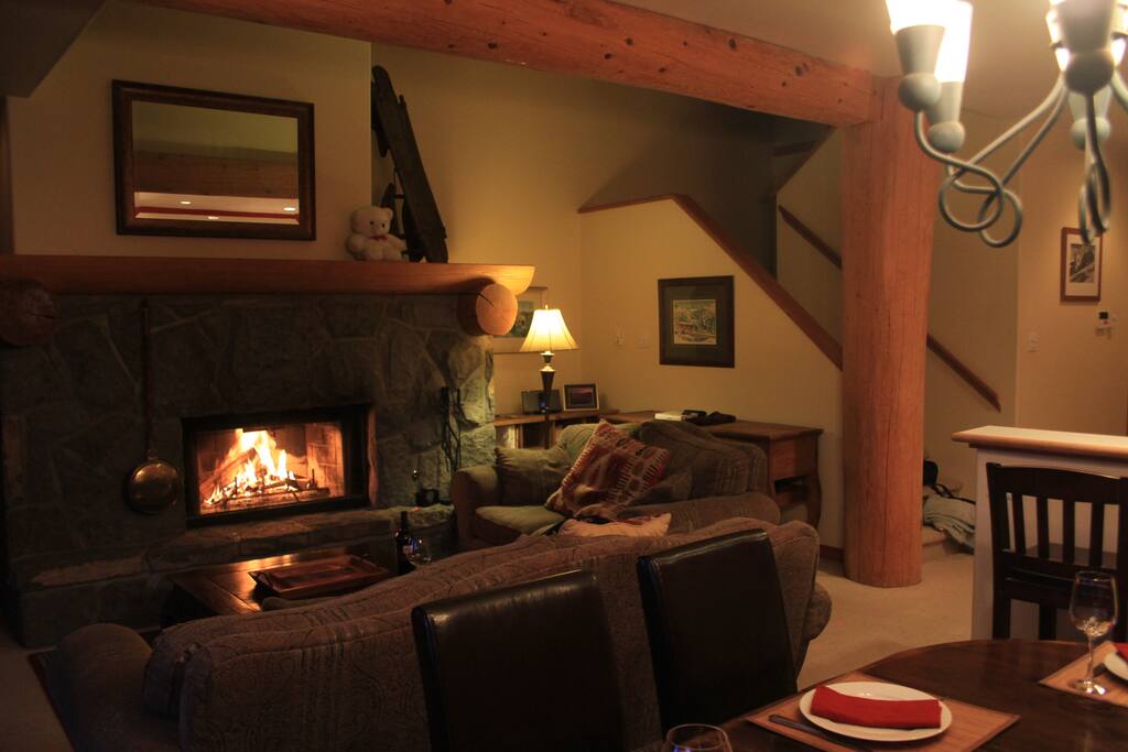 Relax in front of a lodge size wood burning fireplace