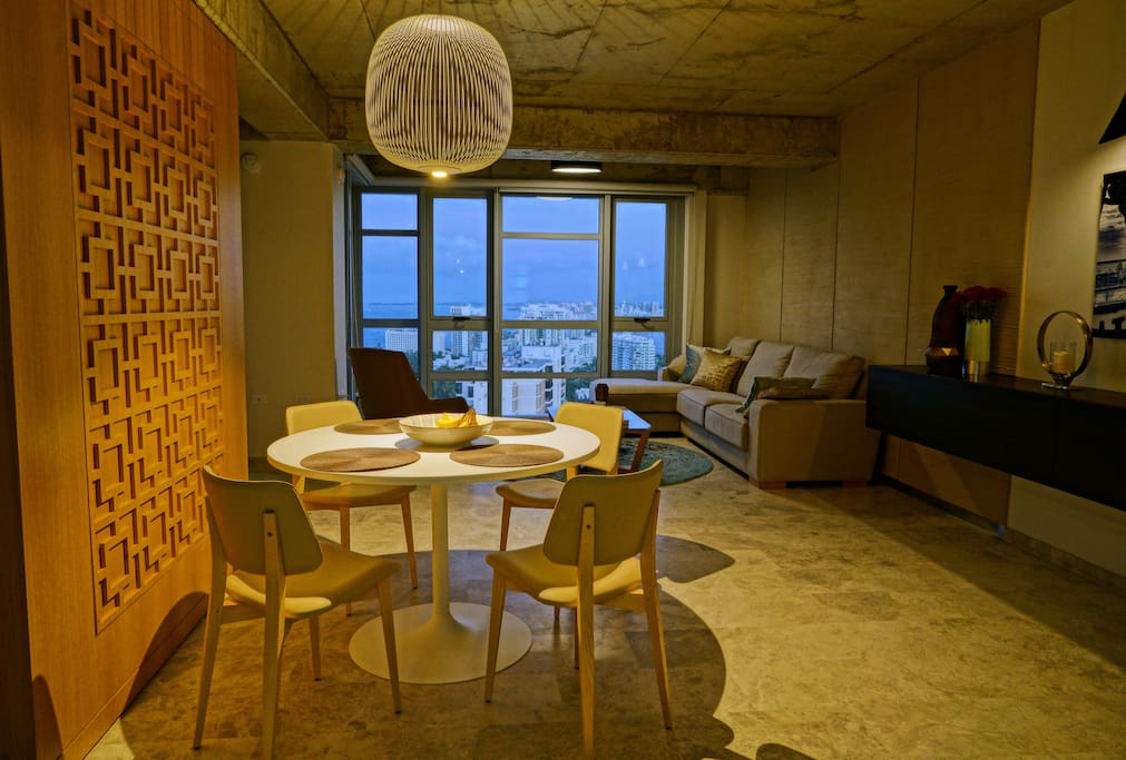 Custom designer builtin furnishings add to the tasteful decor which amply frames the view from the 23rd floor looking out to the Condado and San Juan