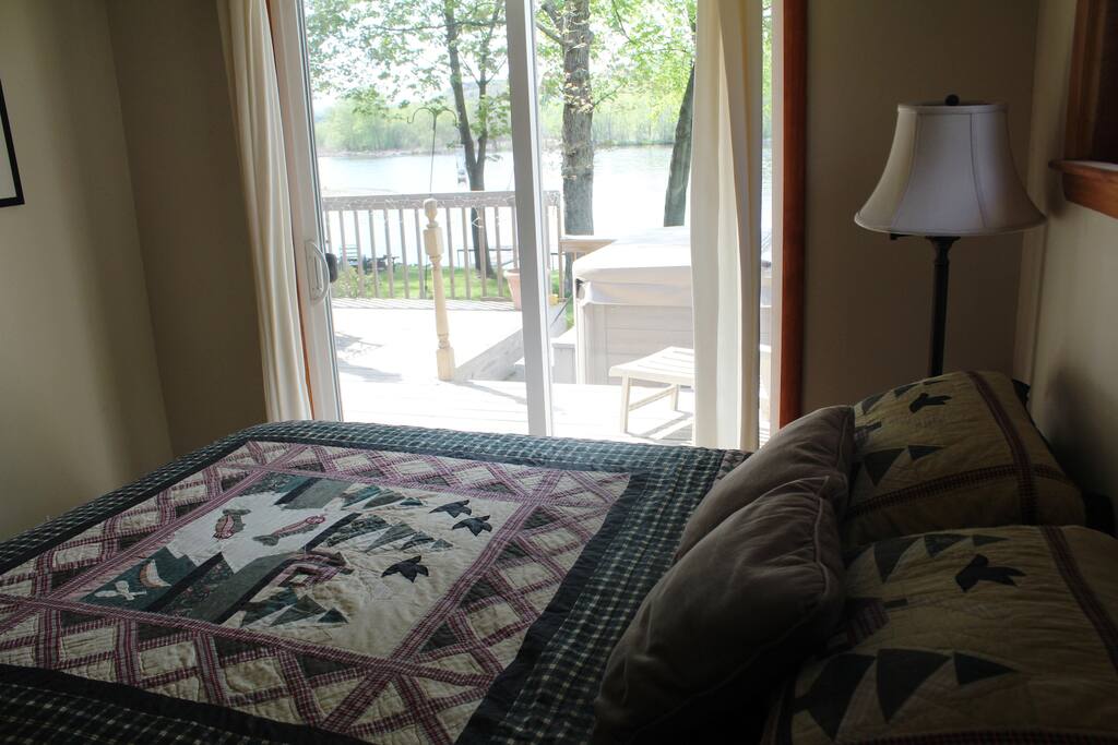 Great view of water and distant hills from queen bed.