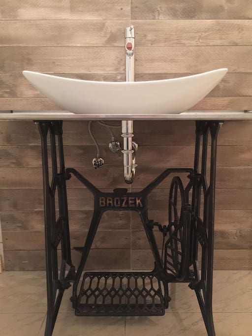 Bathroom - we had fun decorating, using old part of sewing maching, adding brand new designers sink