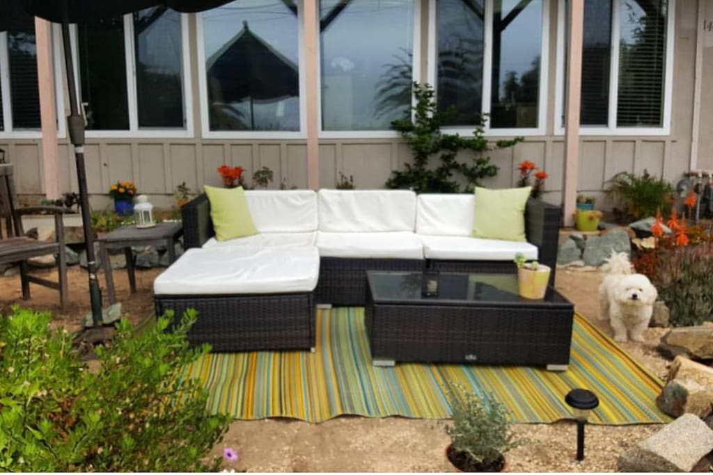 Front patio area looks across the street to the ocean. Great spot to listen to the waves and watch sunset. Dog not included!