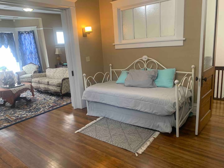 Third Bedroom: twin trundle beds; the lower trundle is on wheels for pull-out.  

The front of the lower trundle has a lever that you lift up to raise the bed and you should feel it lock in place. Release the safety clip and press down to lower. 