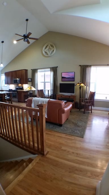 Open great room, leather love-seat and ottoman
