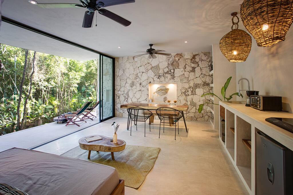 Serene indoor/outdoor living area open to the gardens