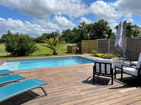 Recent house with swimming pool and large terrace.