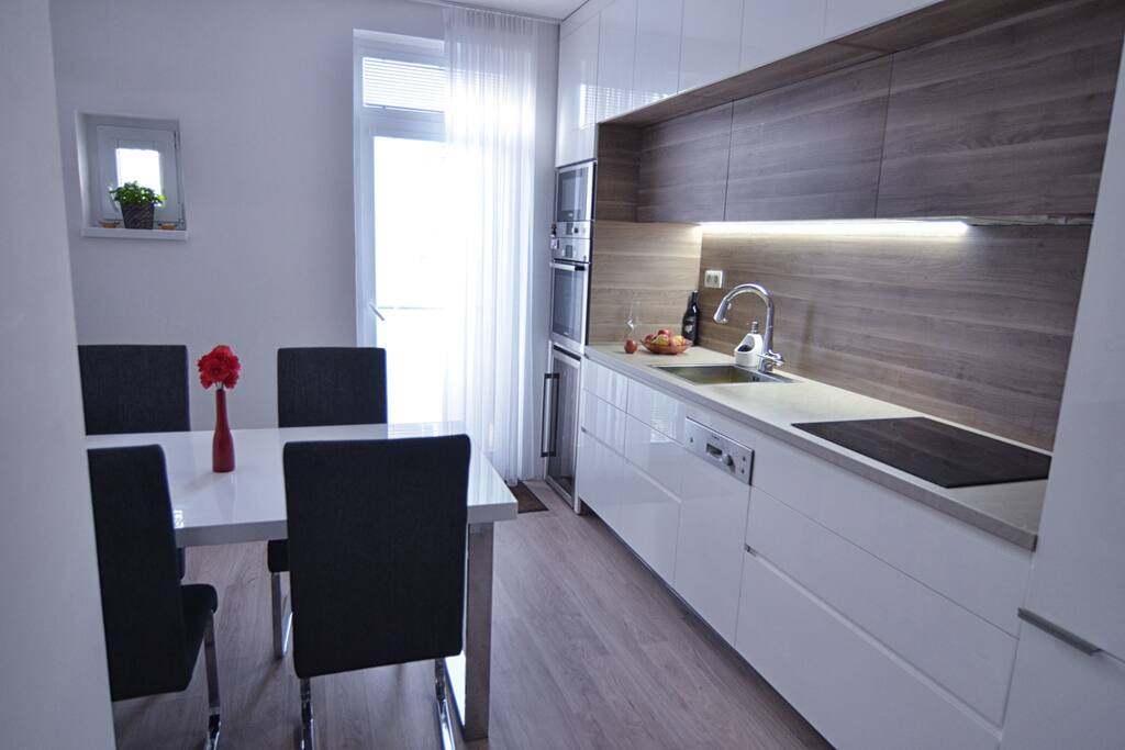 Modern kitchen with full equipment with fine table eating