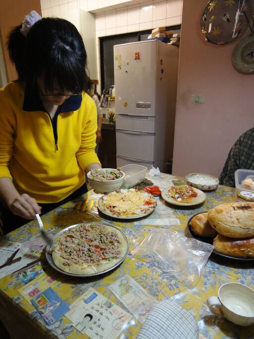 enjoying the cooking and making Pizza.