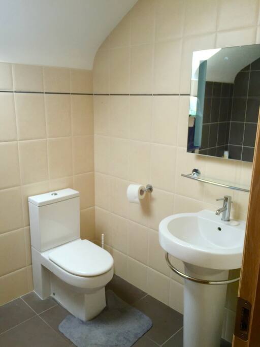 Bathroom next door to double room with jacuzzi and rain shower.