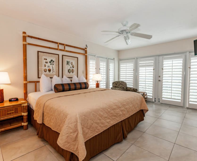 Mater bedroom has double French doors to balcony with water view.