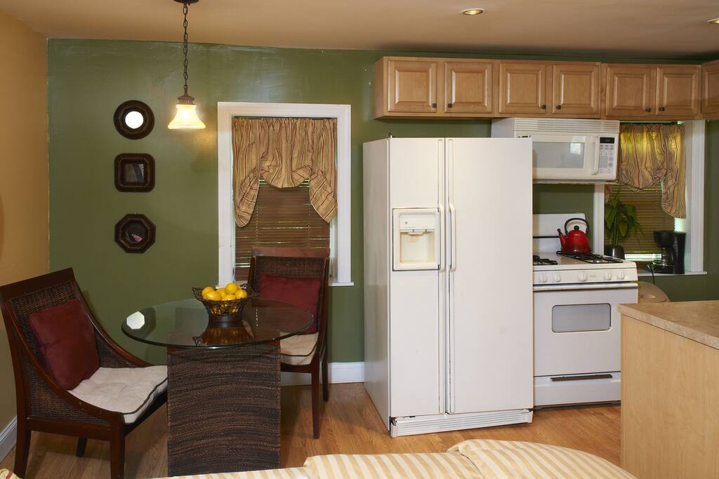 Full size appliances and small seating area are located on the 1st level